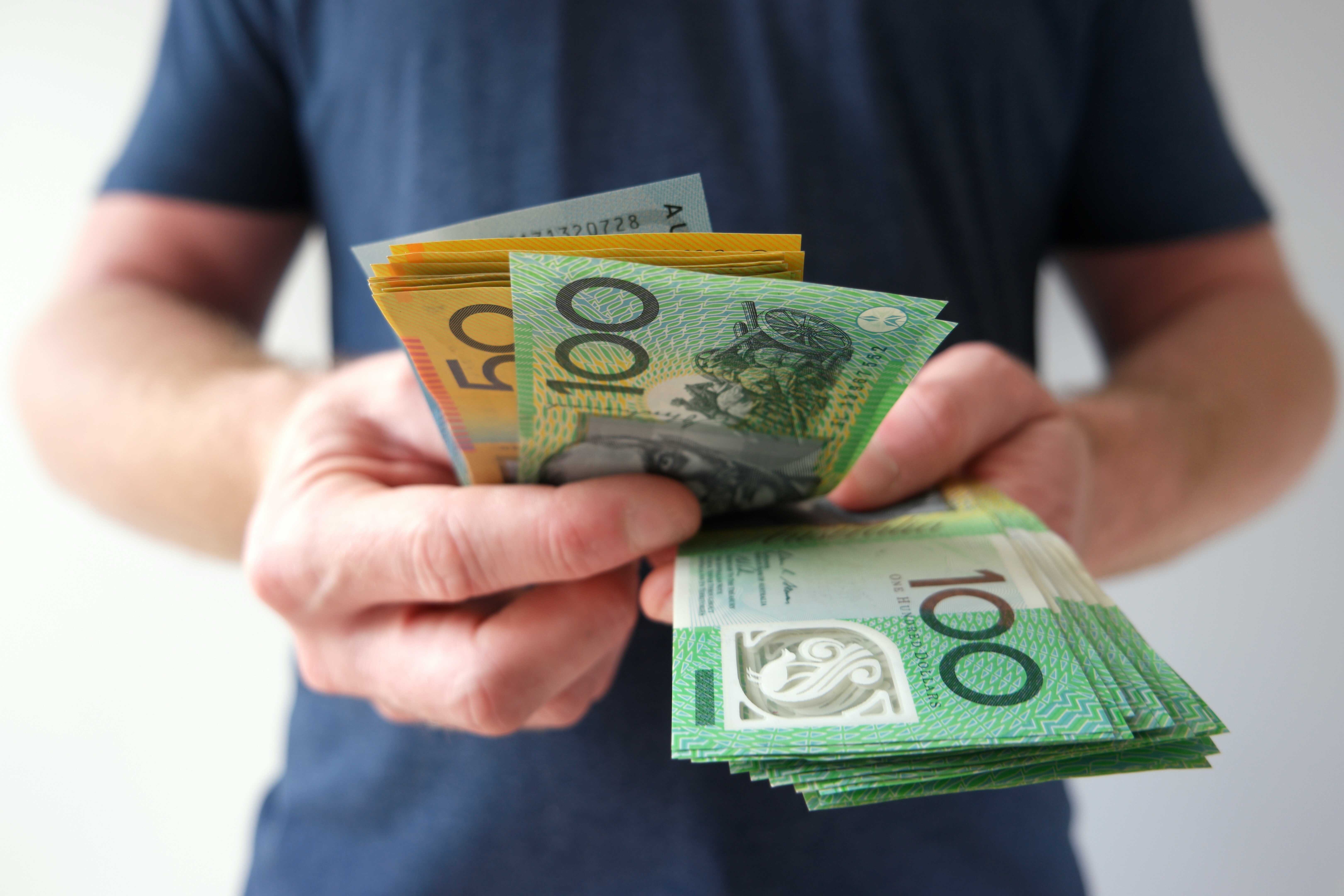 Man counting money savings